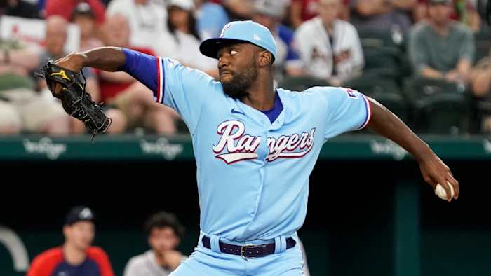 May 1, 2022; Arlington, Texas, USA; Texas Rangers starting pitcher Taylor Hearn (52) pitches during the first inning against the Atlanta Braves at Globe Life Field. Mandatory Credit: Raymond Carlin III-USA TODAY Sports